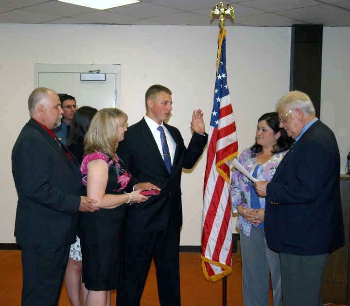 Kyle J. Phlegar is being sworn-in as a Class II Special Police Officer on July 11, 2011